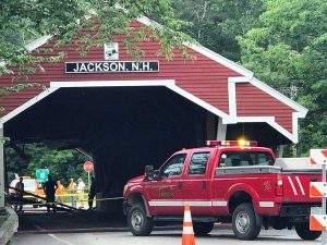 Crews clean up the Honeymoon Bridge following a cement truck failing to clear the cross bracing this past July. ~ Photo courtesy of the Jackson Area Chamber of Commerce